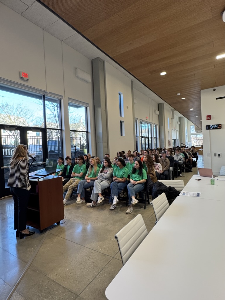 Speaking to a packed student audience
